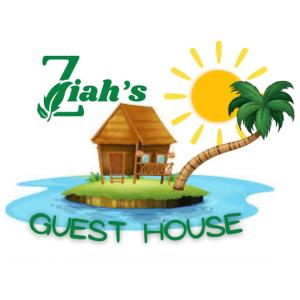 a house on an island with a palm tree at Ziah's Guest House in San Vicente