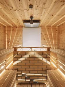 an empty wooden sauna with a white screen at intro vetta 1002 Free Private sauna in Kumamoto