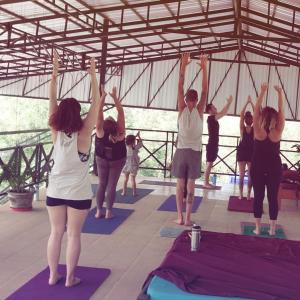 a group of people in a yoga class at CornerStone Nesat in Nesat Village in Phumĭ Chroŭy Svay