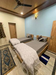 Postel nebo postele na pokoji v ubytování Tattva Paying guesthouse