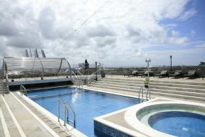 a swimming pool on the top of a cruise ship at Bali Paradise City Hotel in Denpasar