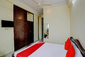 Posteľ alebo postele v izbe v ubytovaní OYO Flagship The Mount View Hotel And Resort
