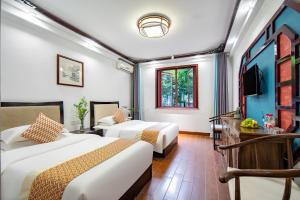Voodi või voodid majutusasutuse Tongli Lanshe Garden B&B toas