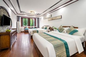 Voodi või voodid majutusasutuse Tongli Lanshe Garden B&B toas