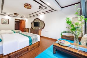 Voodi või voodid majutusasutuse Tongli Lanshe Garden B&B toas