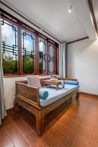 Voodi või voodid majutusasutuse Tongli Lanshe Garden B&B toas