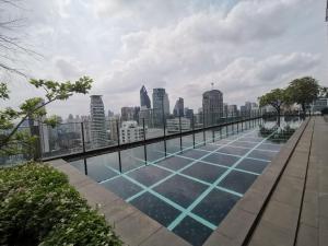 a swimming pool on the roof of a building at 小憩 屋顶无边泳池 terminal21 Phrom phong Asok 21航站楼 阿索 in Bangkok