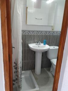 a bathroom with a sink and a toilet at Casa Rural Vata Pampaneira Alpujarra in Pampaneira +29 photos