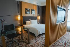 Postel nebo postele na pokoji v ubytování Impiana Hotel Senai