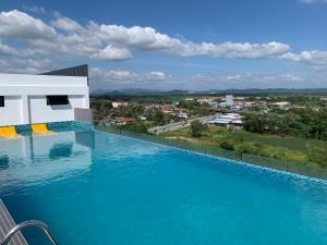 a swimming pool with a view of a city at SOFEA IMPERIO HOMESTAY @ ALOR SETAR in Alor Setar