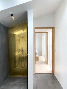 a bathroom with a shower and a door to a room at House in beautiful Copenhagen in Copenhagen