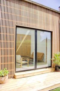 a large glass window on the side of a house at House in beautiful Copenhagen in Copenhagen