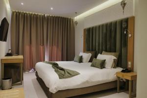 Postel nebo postele na pokoji v ubytování Diwane Hotel & Spa Marrakech