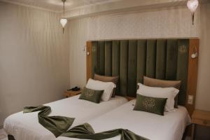 Postel nebo postele na pokoji v ubytování Diwane Hotel & Spa Marrakech