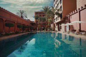 a swimming pool in the middle of a building at Diwane Hotel & Spa Marrakech in Marrakesh
