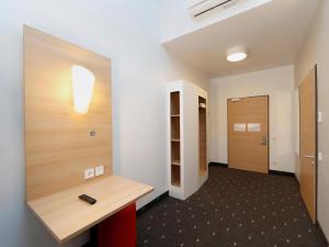 an office with a hallway with a desk and a door at B&B Hotel Berlin-Tiergarten in Berlin