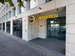 a building with a sign on the side of it at B&B Hotel Berlin-Tiergarten in Berlin