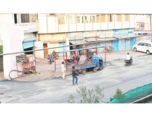 a group of people standing on a city street at Geeta Lodge, Solapur in Solapur