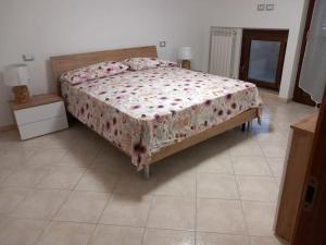 Giường trong phòng chung tại Casa Azzurra