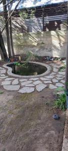 a small pool of water on a stone walkway at B&B Villa Victoria in Ragusa