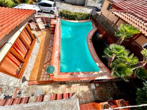 an overhead view of a swimming pool next to a house at Casa Nicolò in Massa Lubrense