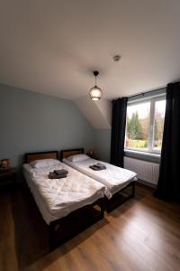 Postel nebo postele na pokoji v ubytování AINO Hotel