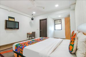 Postel nebo postele na pokoji v ubytování FabHotel Moro Rohini Sector 11