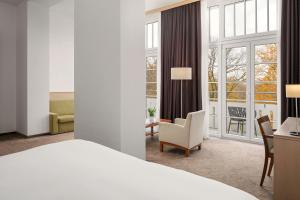 Łóżko lub łóżka w pokoju w obiekcie Harvey Spa Hotel