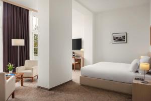 Telewizja i/lub zestaw kina domowego w obiekcie Harvey Spa Hotel