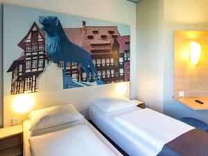 Postel nebo postele na pokoji v ubytování B&B Hotel Braunschweig-City + 22 fotografií