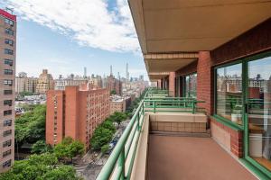 a balcony of a building with a view of a city at Beautiful 1 BR Apartment in Columbus Avenue in New York