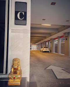 a parking garage with a car parked in it at เสาวลักษณ์ เรสซิเด้นท์ in Khon Kaen