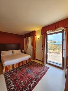 Postel nebo postele na pokoji v ubytování Hotel Villa Lauri