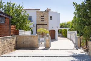 a house with a gate and a fence at Villa Shanta in Peyia