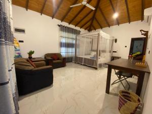 a living room with a large aquarium in the middle of it at See Turtle Villa in Tangalle