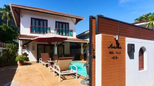 a villa with a swimming pool and a house at Ananda Private Pool Villa, Ao Nang in Krabi