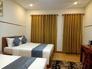 Ліжко або ліжка в номері Nimith Hotel & Restaurant