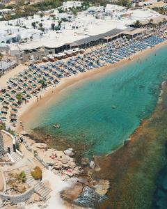 an aerial view of a beach with chairs and umbrellas at Paradise Beach Resort in Paradise Beach