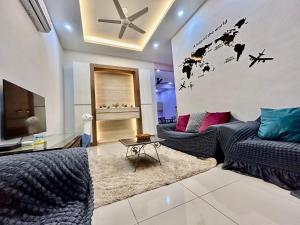 a living room with a plane mural on the wall at Home36#8pax#4bedroom#NearAeonAlma#Mcd in Bukit Mertajam +28 photos