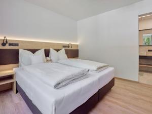 Ένα ή περισσότερα κρεβάτια σε δωμάτιο στο Apartment s`Groasse am Hannesnhof by Interhome