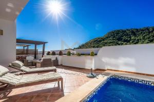 a house with a swimming pool and a patio at Four Bedroom Atalayas Ii Villa - La Manga Club in Atamaría