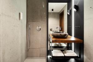 a bathroom with a sink and a shower at New Port Apartments on the River in Krakow +38 photos