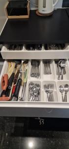 a drawer filled with utensils in a kitchen at Apartamentos completo con todas las comodidades in Brussels