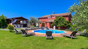 a house with a swimming pool in the yard at Charming stone Villa Carla near the sea and town by WiiBuk in Pula