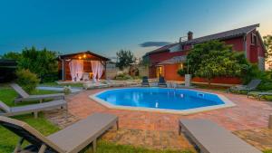 a swimming pool in the yard of a house at Charming stone Villa Carla near the sea and town by WiiBuk in Pula