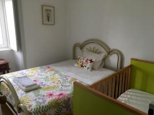 Ένα ή περισσότερα κρεβάτια σε δωμάτιο στο Akivillas Santarém Dainty