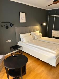 Postel nebo postele na pokoji v ubytování DK Hotel Heidelberg
