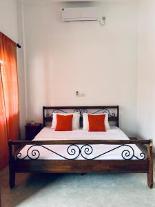 Ein Bett oder Betten in einem Zimmer der Unterkunft One Bhakthi