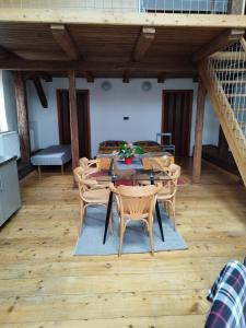 a dining room with a table and chairs at Apartmán Horní Heřmanův Městec u Chrudimi in Hermanuv Mestec +10 photos