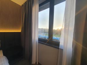 Ein Bett oder Betten in einem Zimmer der Unterkunft Avenue21